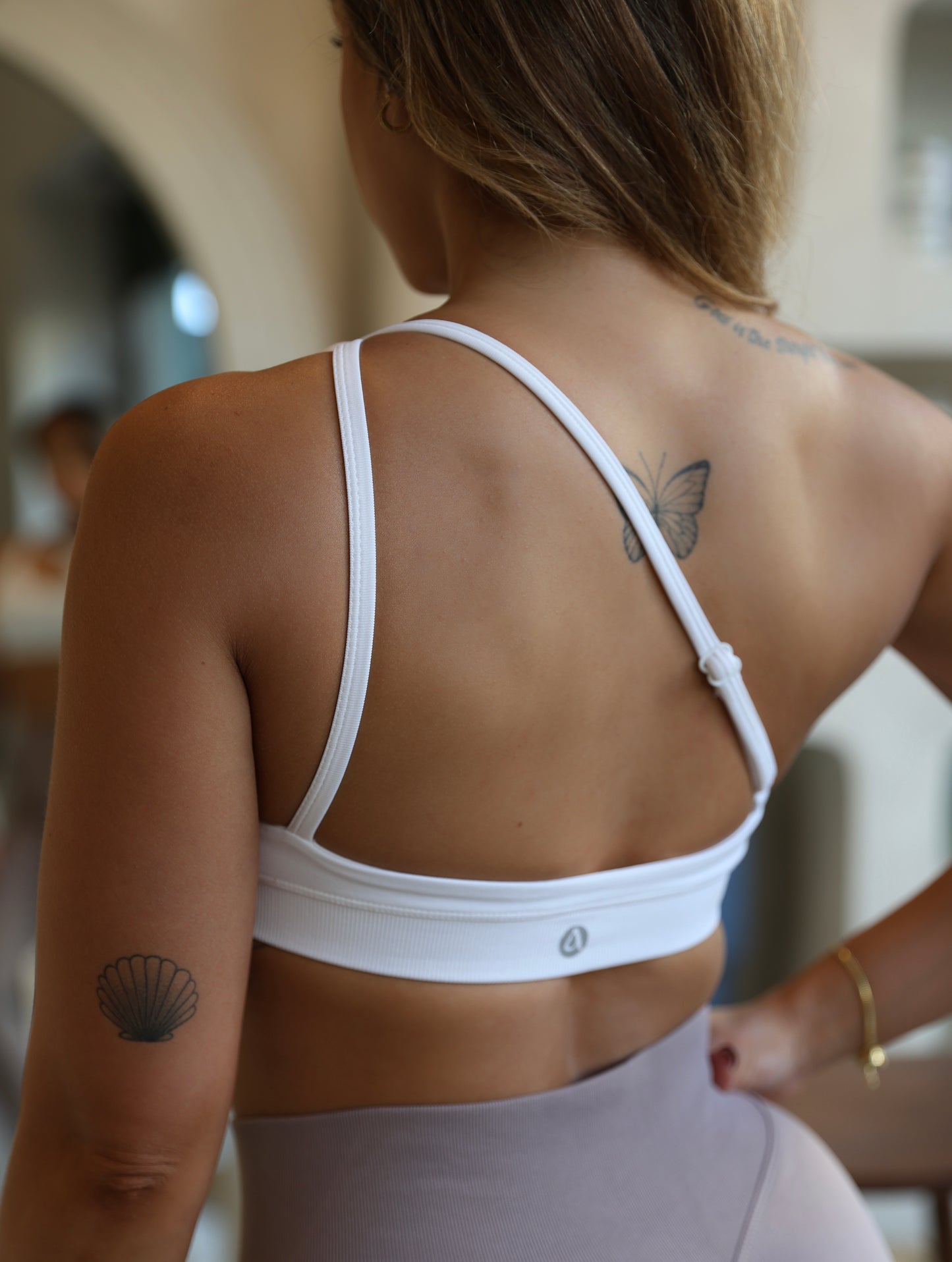 Crossed shoulder sports bra