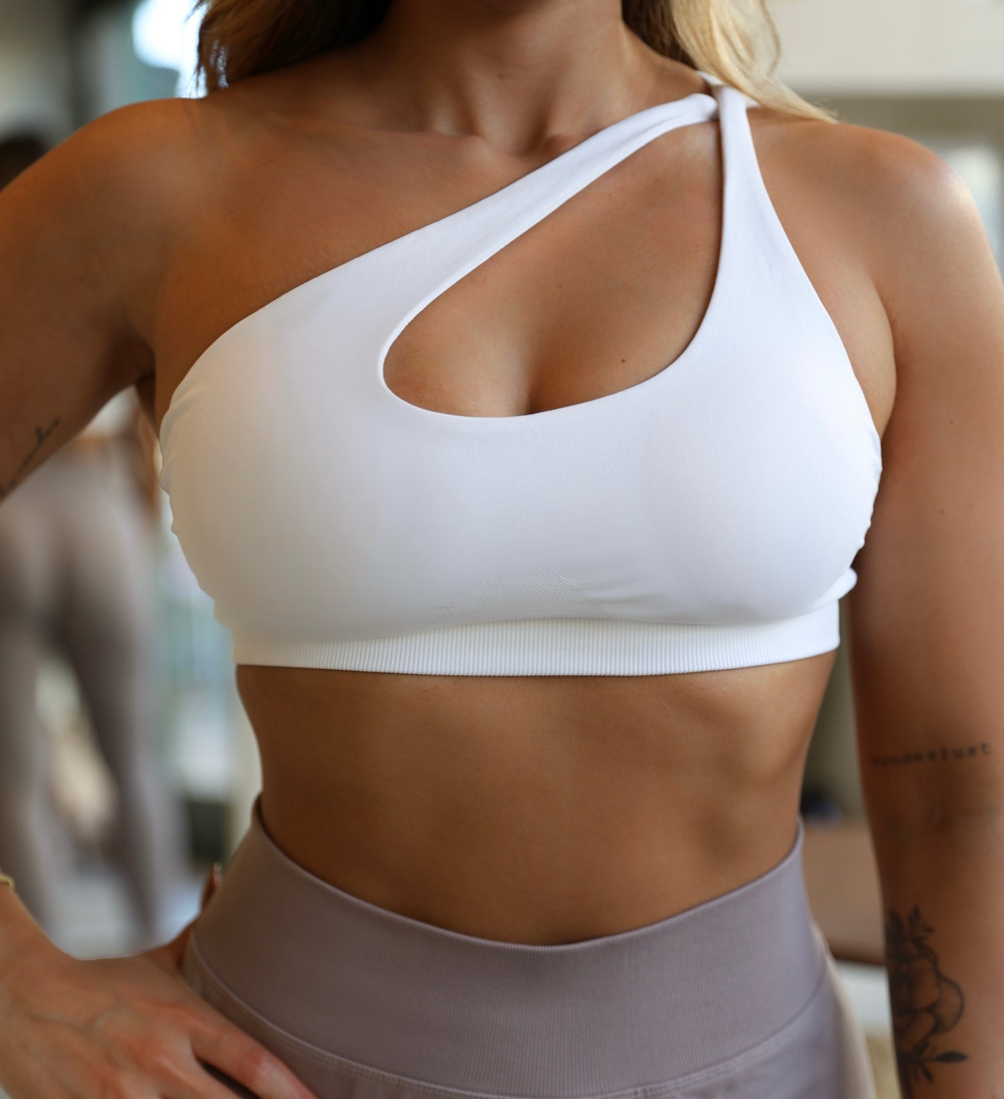 Crossed shoulder sports bra